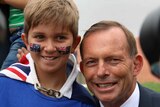 Proud young citizen celebrates Australia Day with Prime Minister Tony Abbott.