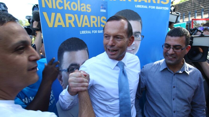 Tony Abbott with Liberal candidate for Barton Nickolas Varvaris in Arncliffe on election day