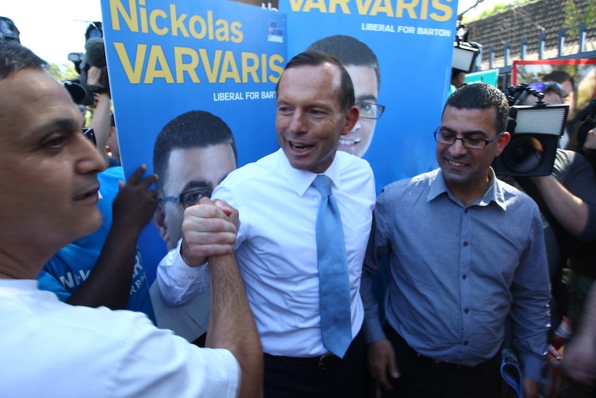 Tony Abbott with Liberal candidate for Barton Nickolas Varvaris in Arncliffe on election day