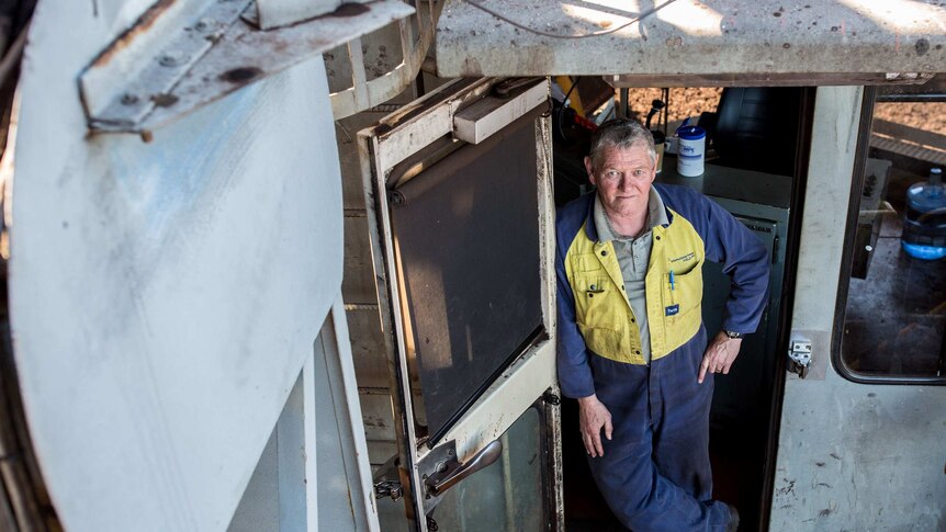 Dave Andrew, 64, at the door of his dredger.