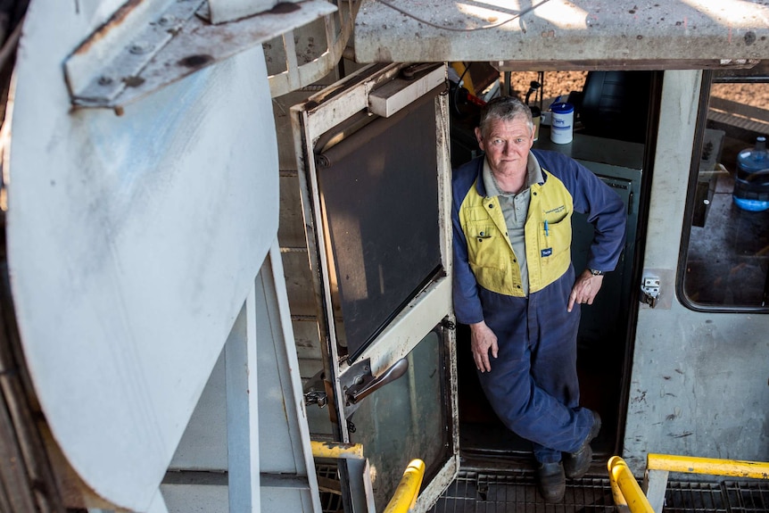 Dave Andrew, 64, at the door of his dredger.