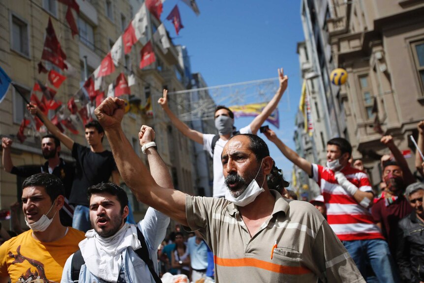 Demonstrators shout slogans during the protest in Istanbul.