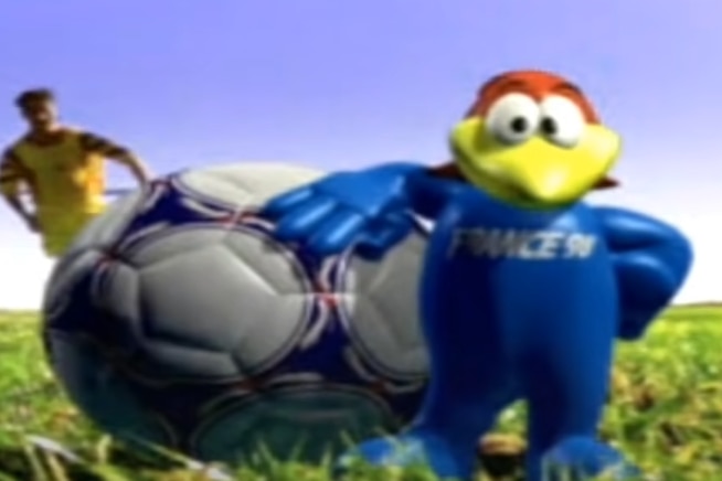 A cartoon rooster rests on a soccer ball.