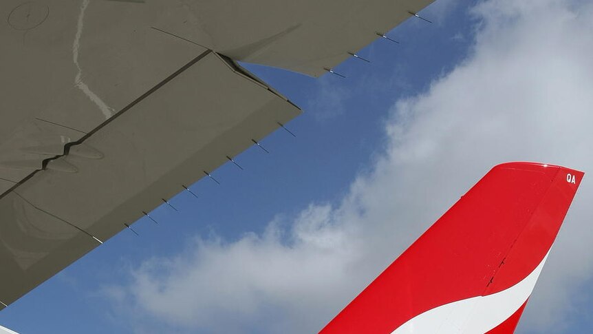 Qantas A380 taxis past fleet