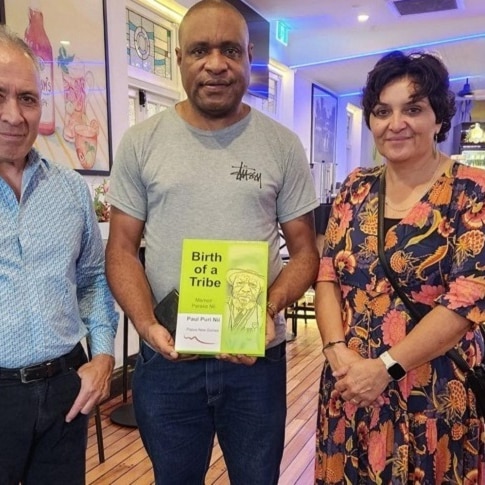 Paul Puri Nii poses with his book 'Birth of a Tribe'