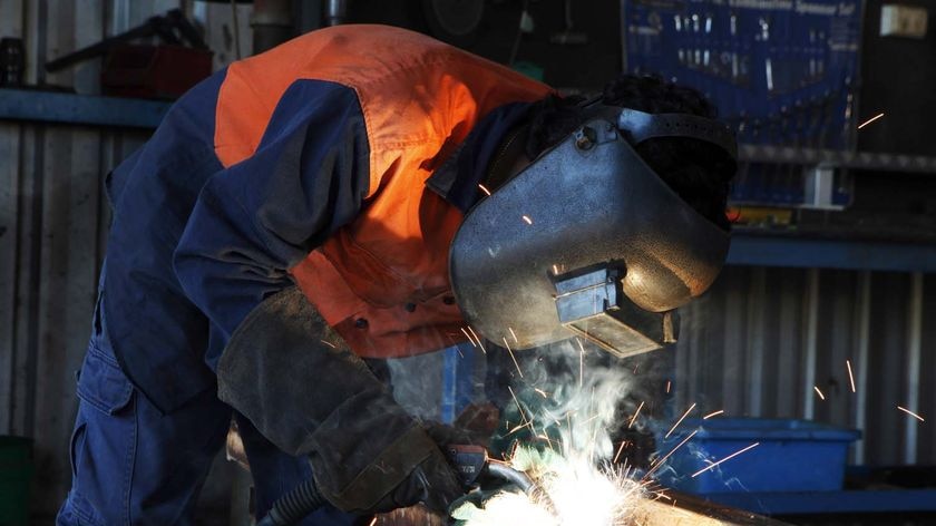 A worker welds at Karratha Aluminium