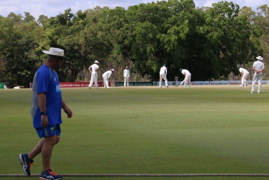 Darren looking on to the Australian cricket team batting during a match in Darwin