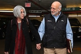Alan and Judy Gross walk through a parking garage after arriving for a news conference at a law firm in Washington December 17, 2014