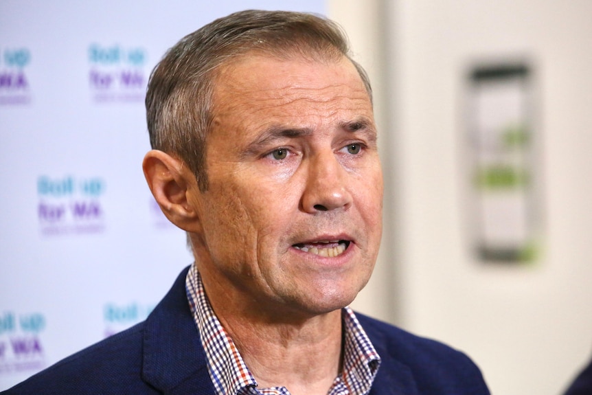 Roger Cook speaking to the media at vaccination centre in Perth.