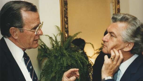 George HW Bush (left) is locked in a conversation with Bob Hawke (right) at a function in Washington in 1983.