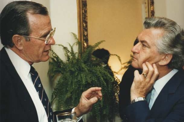 George HW Bush (left) is locked in a conversation with Bob Hawke (right) at a function in Washington in 1983.