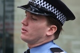 First Class constable Tom Gryta and an unknown man standing outside court