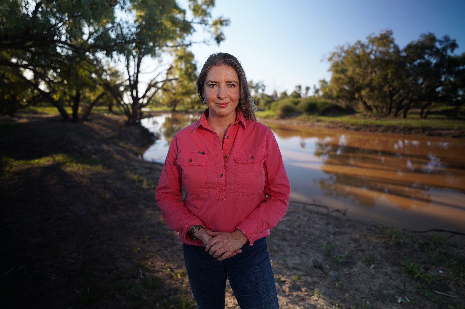 Victoria Pengilley in a desert landscape, facing the camera.