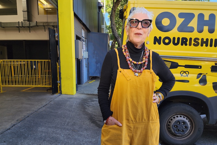 OzHarvest CEO Ronni Kahn wearing yellow overalls