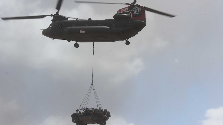 Chinook helicopter with vehicle underneath