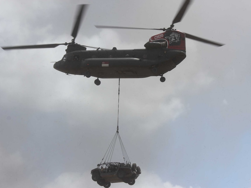 Chinook helicopter with vehicle underneath