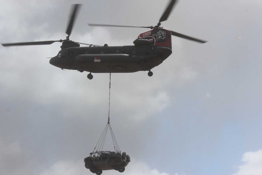 Chinook helicopter with vehicle underneath