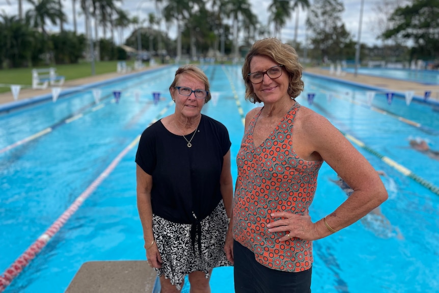 Two middle aged women standing in front of lanes in Anzac Pool