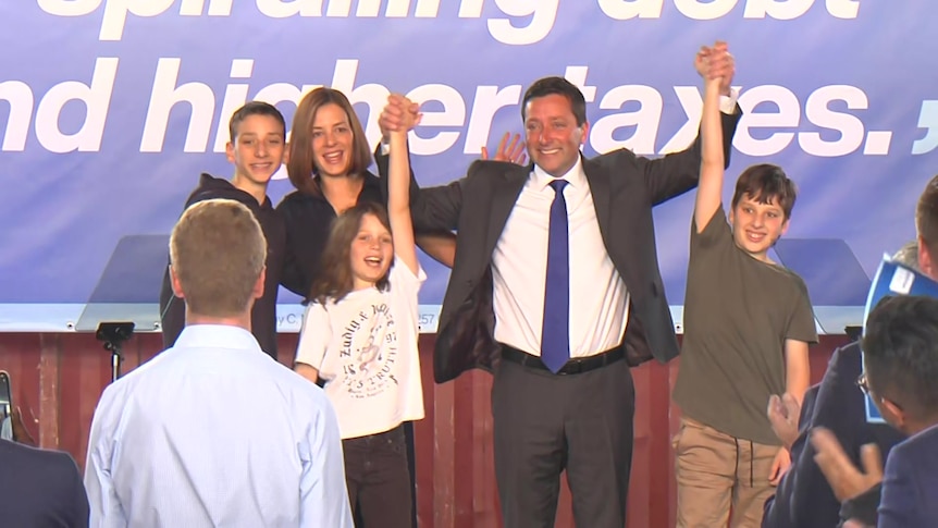 Matthew Guy celebrates with his two sons, wife and daughter.