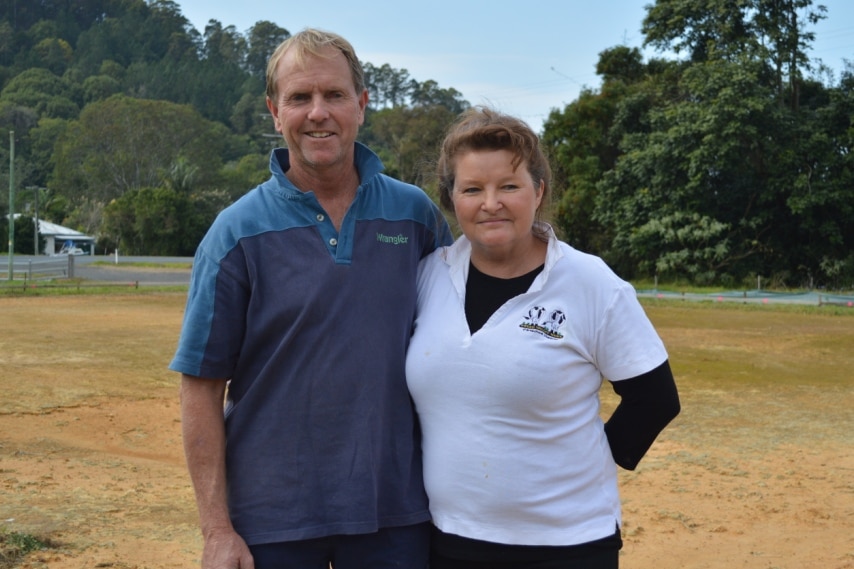 Rob and Sue Harnett, standing together, with the construction zone marked out around them.