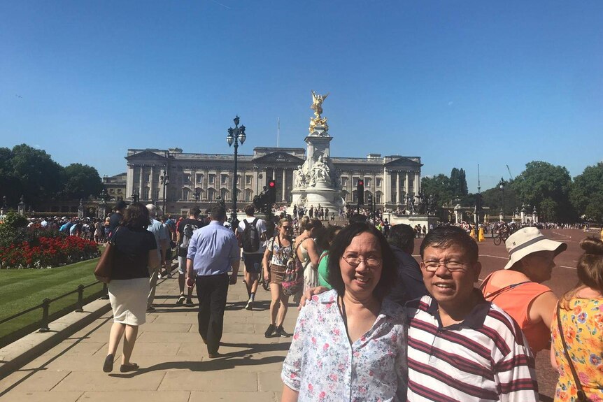Chau Van Kham and Trang Chau in front of Buckingham Palace during an overseas holiday in 2018.
