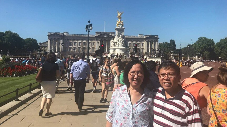 Chau Van Kham and Trang Chau in front of Buckingham Palace during an overseas holiday in 2018.