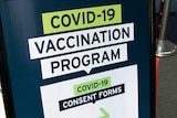 Sign at COVID-19 vaccination clinic in Tasmania.