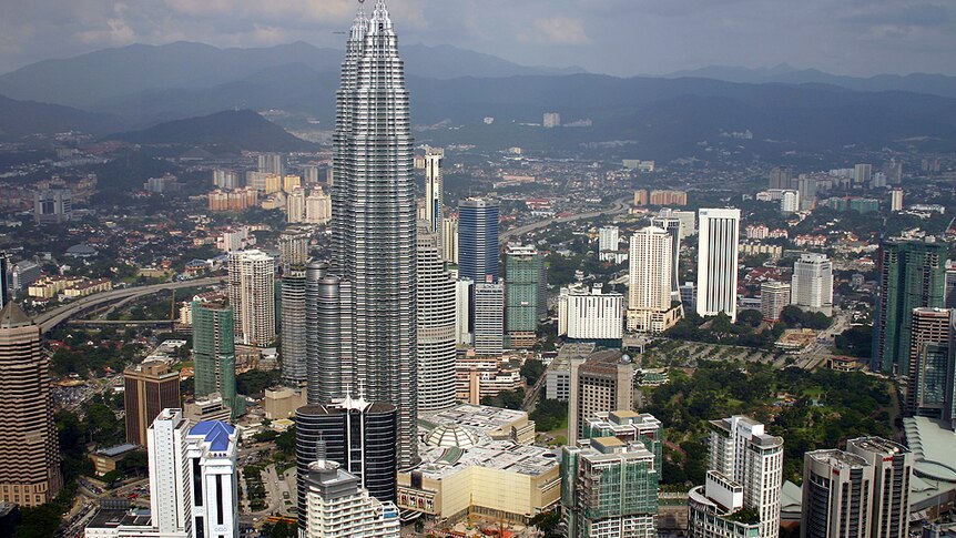 Skyline of Kuala Lumpur, Malaysia, showing a tall buildings densely packed together.