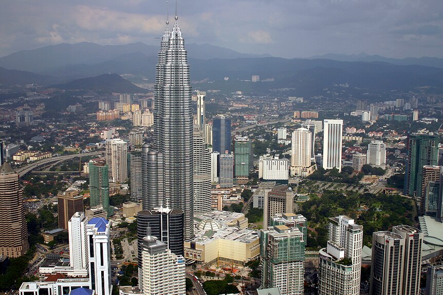 Skyline of Kuala Lumpur, Malaysia, showing a tall buildings densely packed together.
