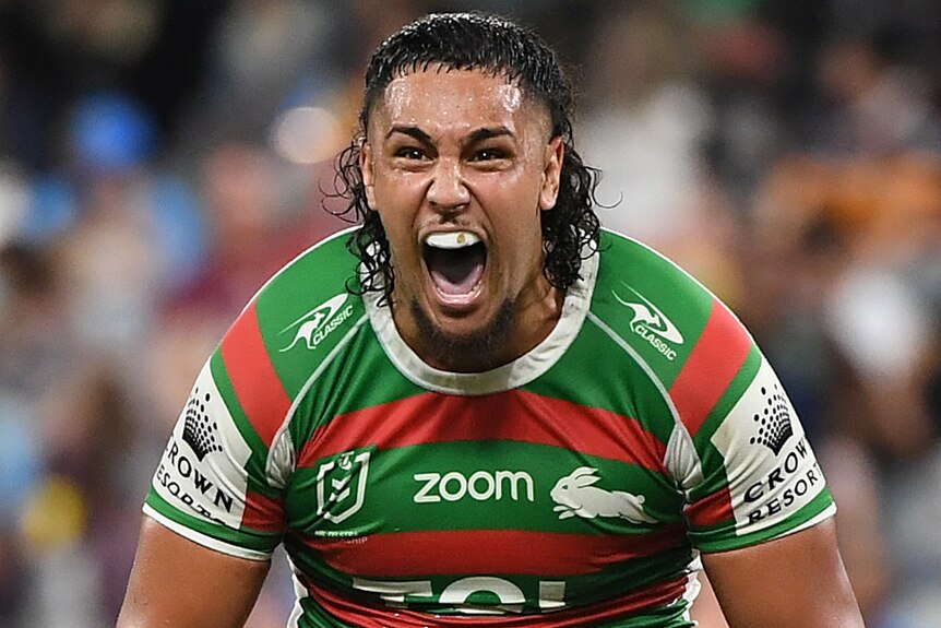 A South Sydney NRL player screams as he celebrates beating Penrith in their qualifying final.