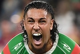 A South Sydney NRL player screams as he celebrates beating Penrith in their qualifying final.