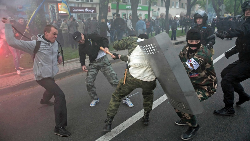 Pro-Russian and pro-Ukrainian supporters clash during a pro-Ukrainian rally in Donetsk, eastern Ukraine on April 28, 2014.