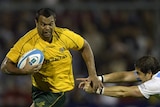 Kurtley Beale takes on the Pumas defence with ball in hand.