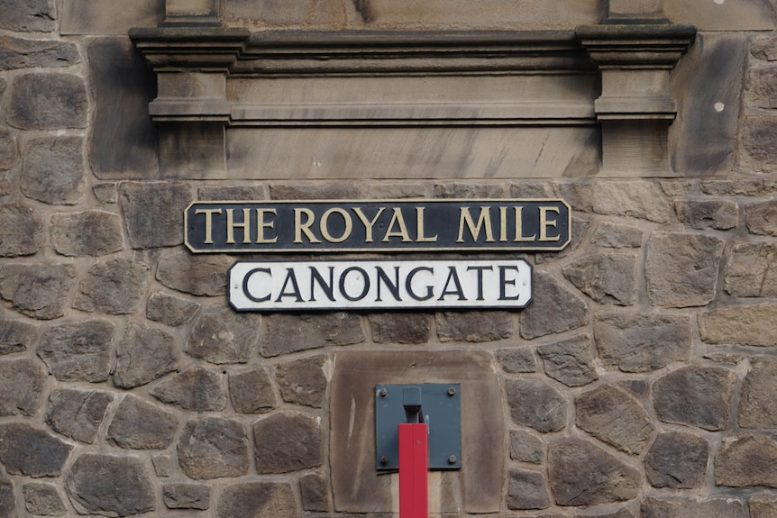 A sign in the stonework says 'The Royal Mile'