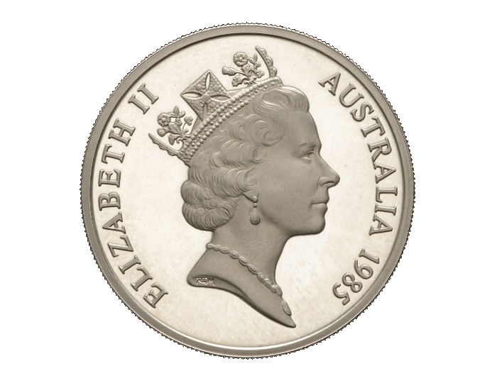 Una moneda de plata australiana de 1985 con una efigie de la reina Isabel II con una corona.  Ella parece ser de mediana edad. 