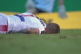 Josh Dugan lies on the ground after being knocked out