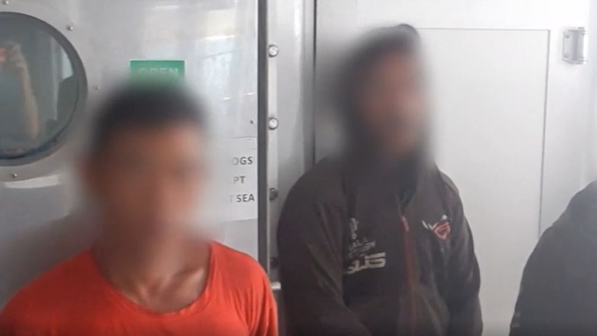 Two alleged Indonesian fishers with faces blurred.