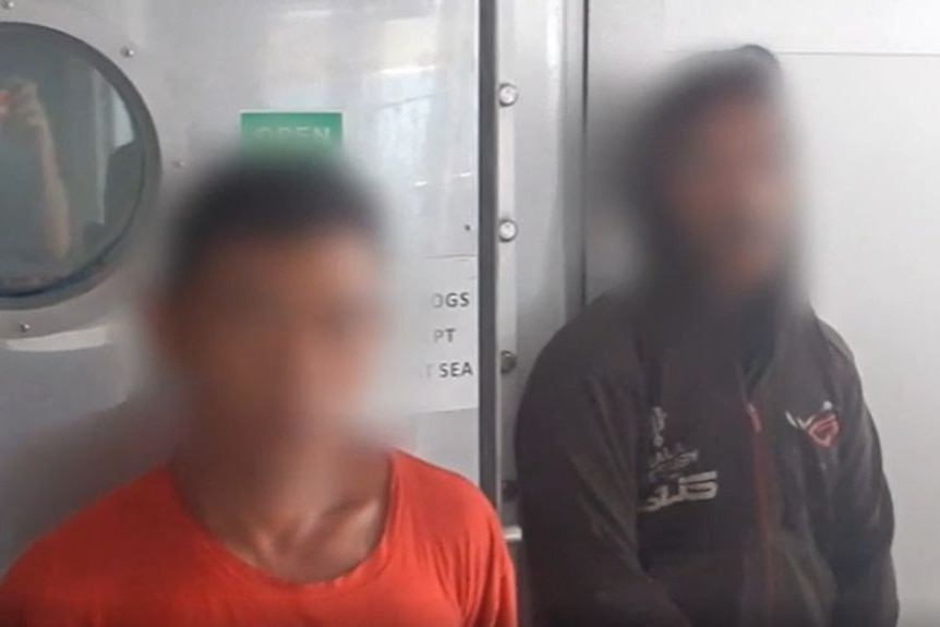 Two alleged Indonesian fishers with faces blurred.