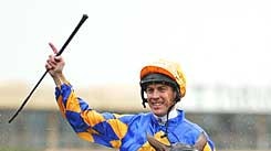 Jockey Steven King salutes the crowd after guiding Fields of Omagh to victory in the 2003 Cox Plate.