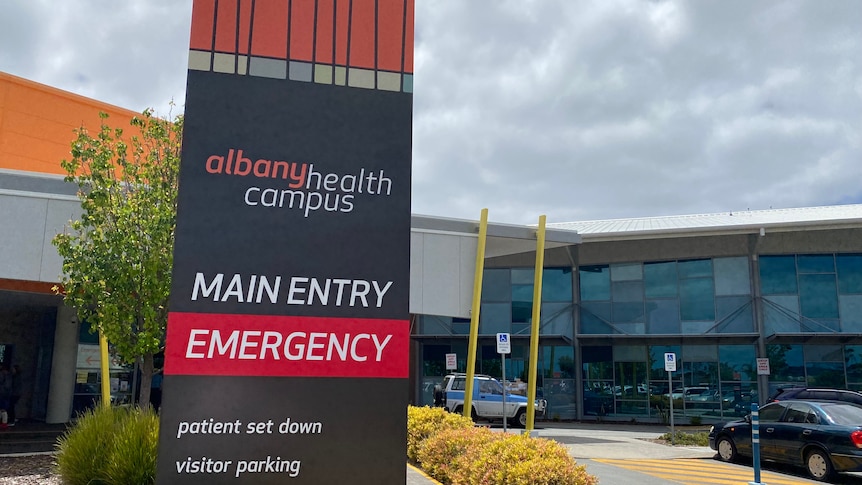 Main entrance sign to albany health campus with hospital in background