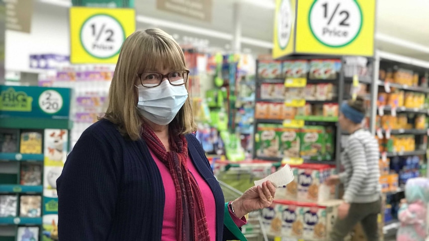 Brenda Elford wearing surgical face mask in Woolworths shopping centre