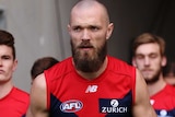 Max Gawn has a steely look on his face as he walks onto the field ahead of his teammates.