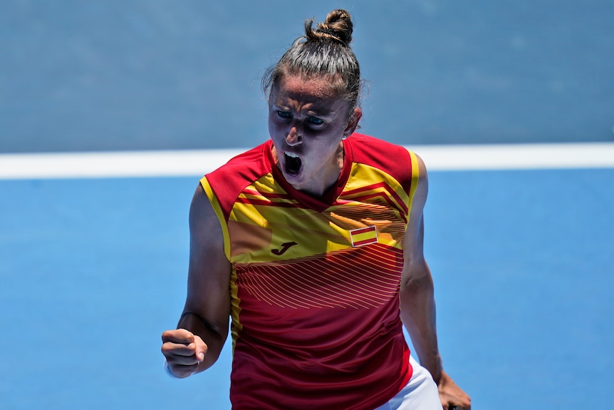 Sara Sorribes Tormo celebrates during her first round tennis match in Tokyo.