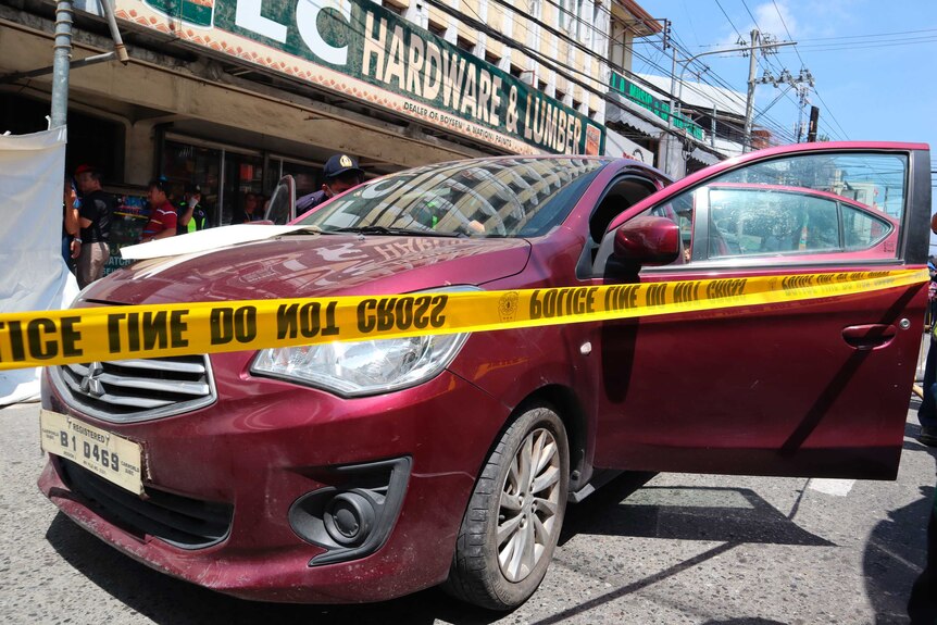 police check a car in Olongapo
