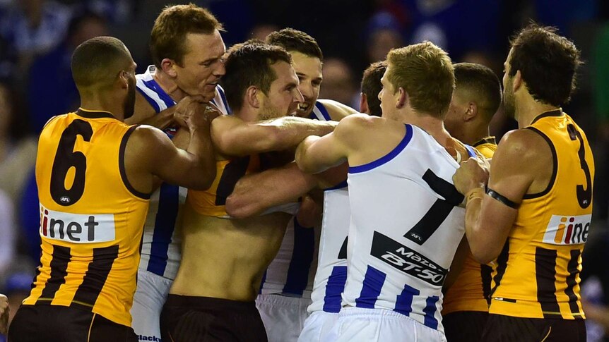 Hawthorn and North Melbourne players brawl at Docklands