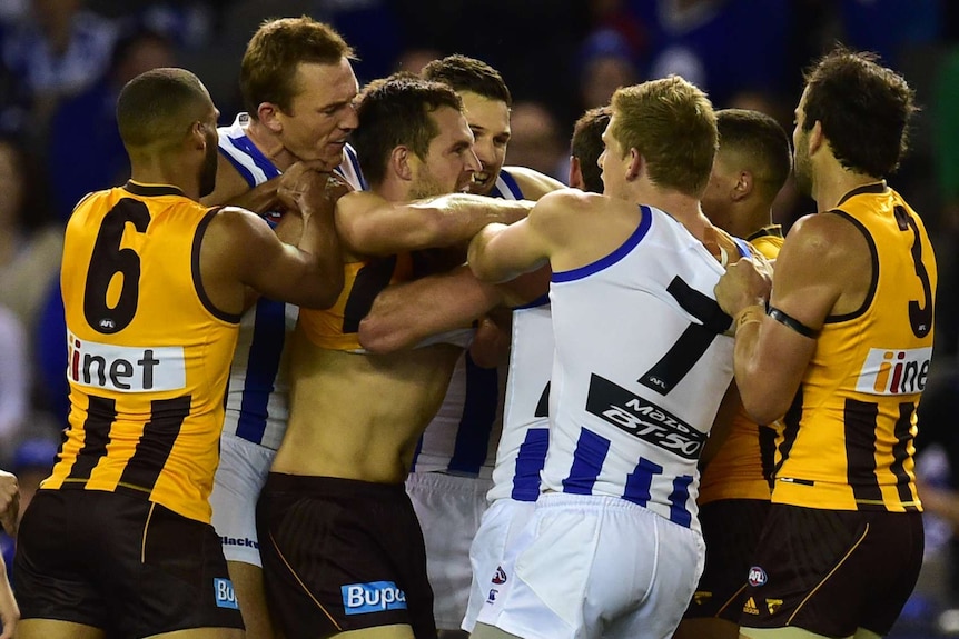 Heated moment ... Luke Hodge (third from left) wrestles with Kangaroos players