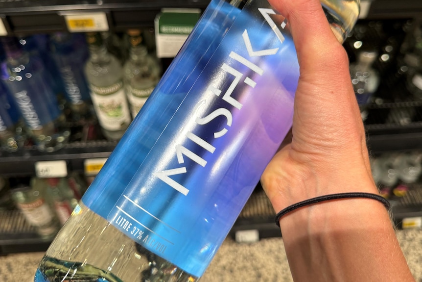 a bottle of vodka with the words mishka 