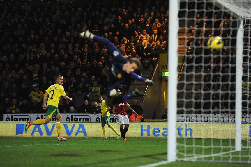 Carrow Road shock ... Norwich's Anthony Pilkington scores the winner against Manchester United.