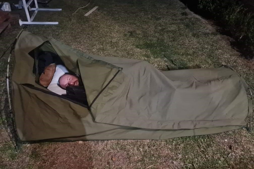 Stuart Kemp in a sleeping bag