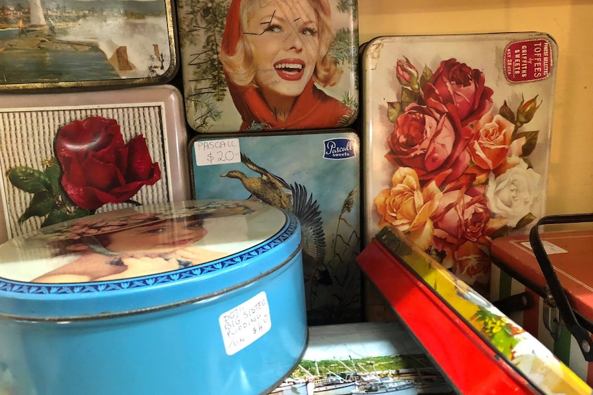 A photo of old tins in a shop 